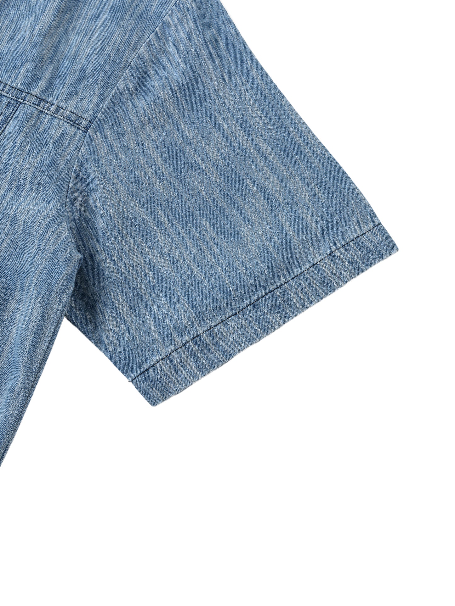 Flat lay of sustainable 230 GSM Future-Homme denim forward distressed short sleeve button down shirt blue frontside sleeve on a white background 