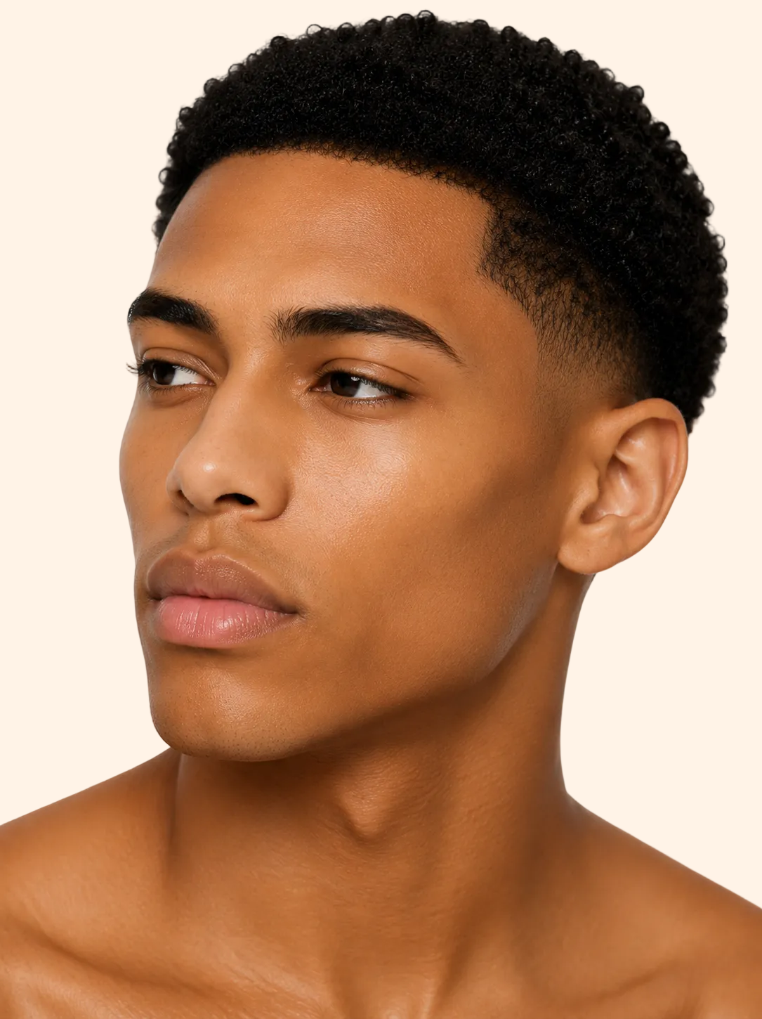 Man with styled hair on a plain background