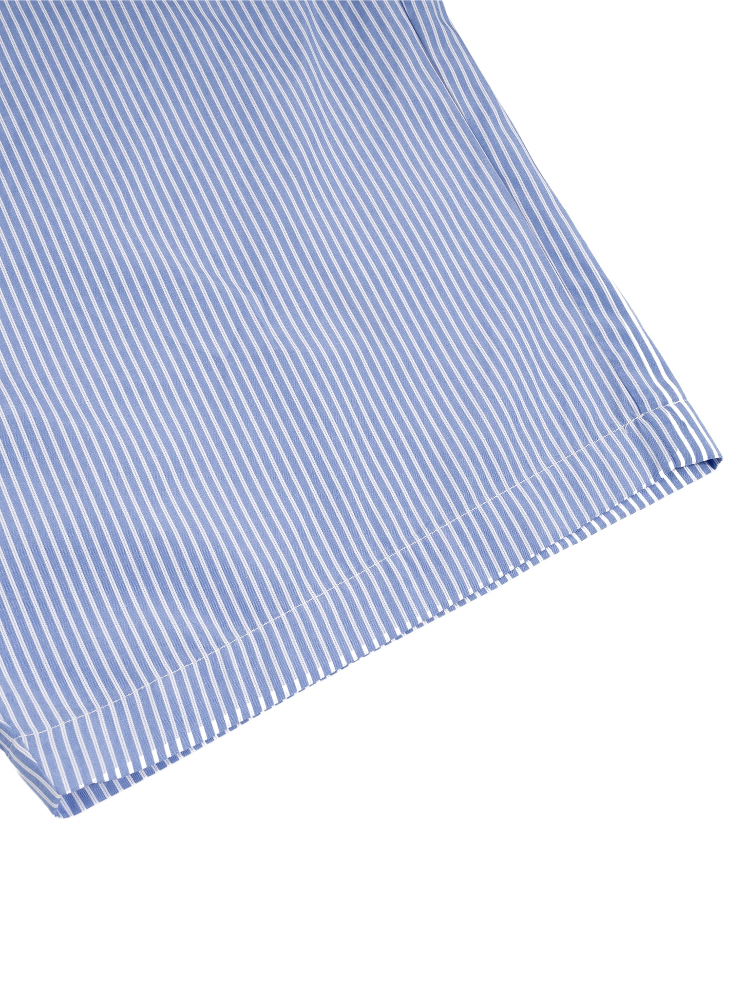 Close-up of a blue and white striped fabric on a white background