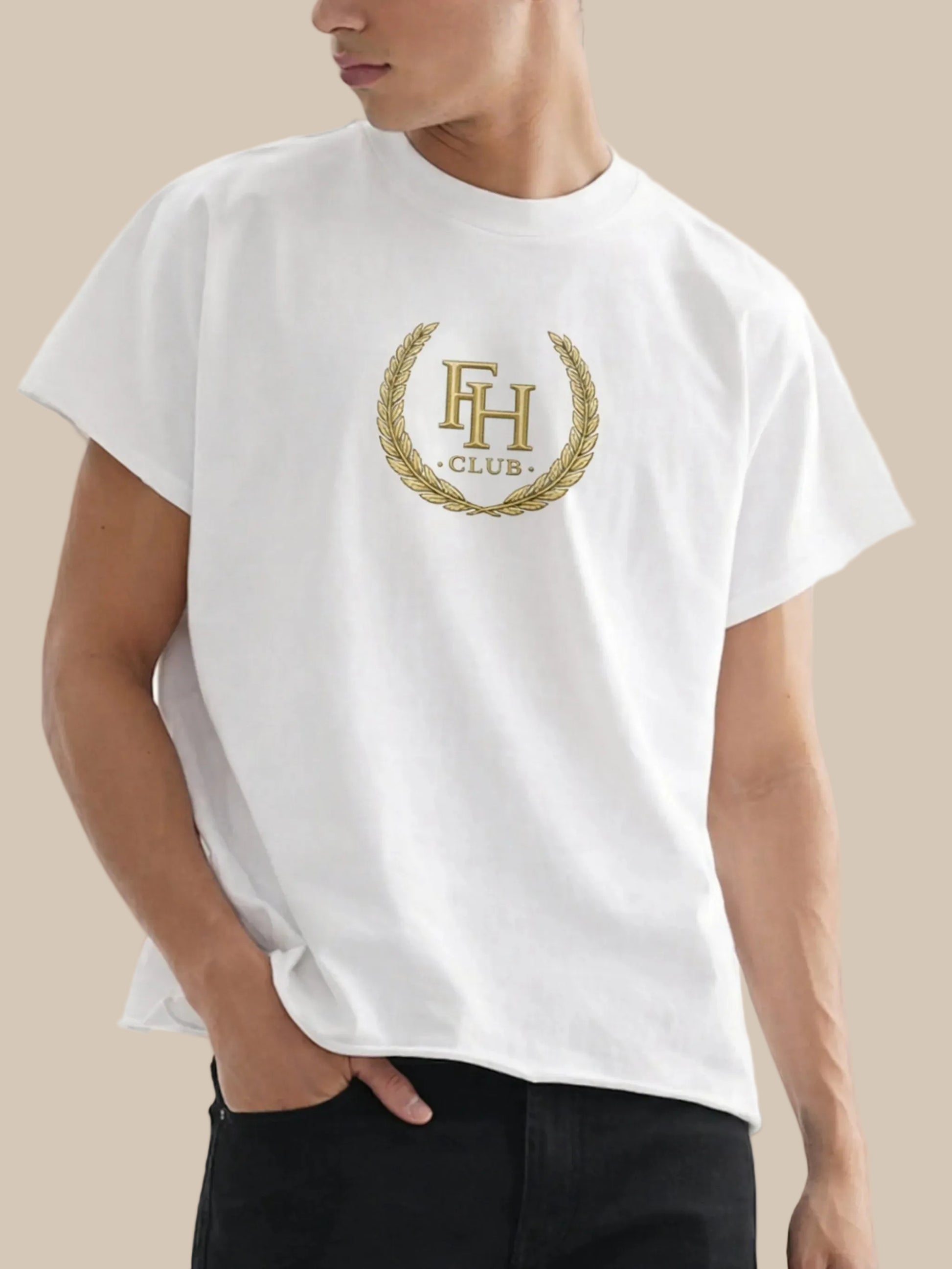 White t-shirt with a gold logo worn by a person on a white background