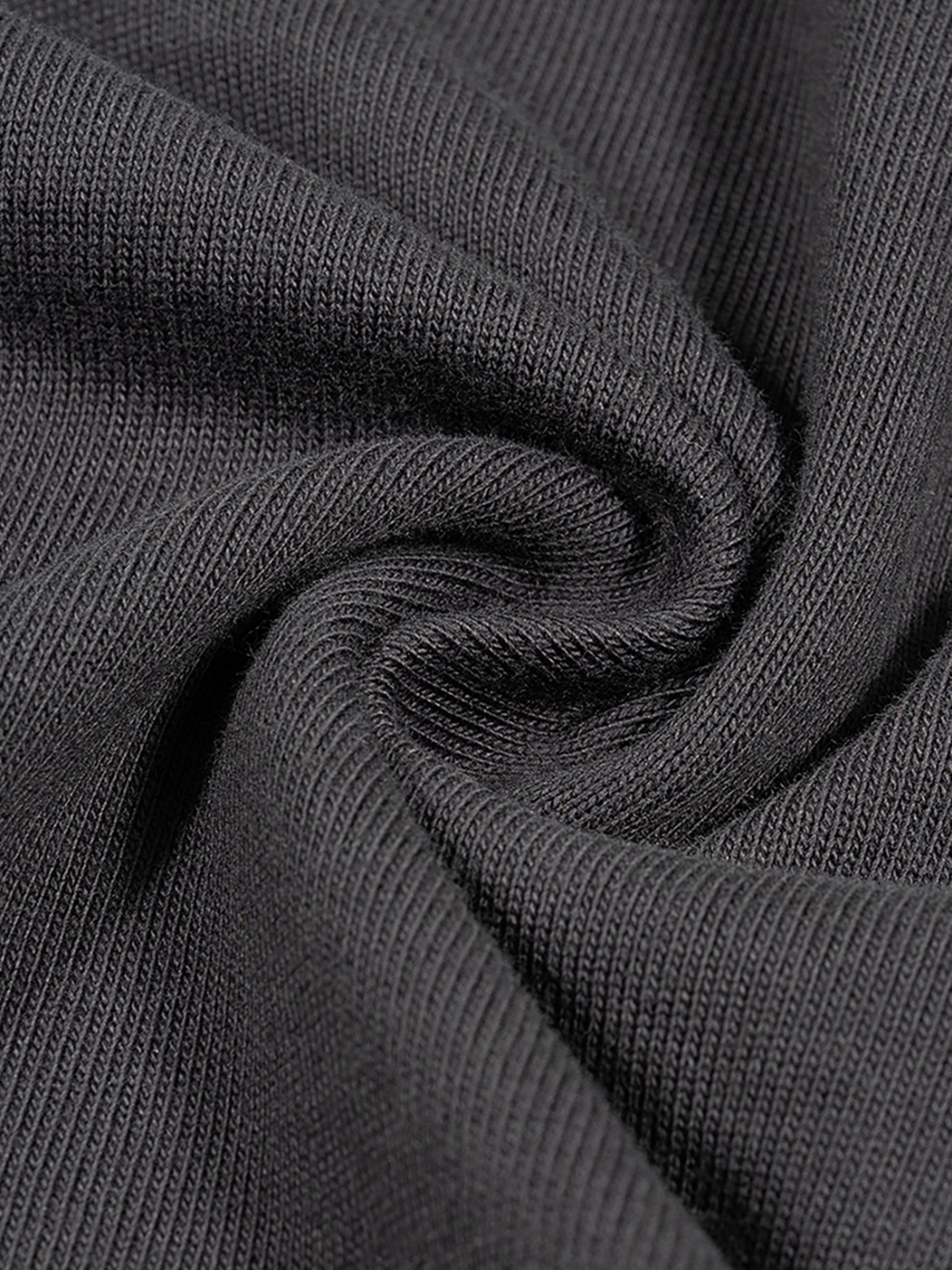 Close-up of dark gray fabric with visible texture