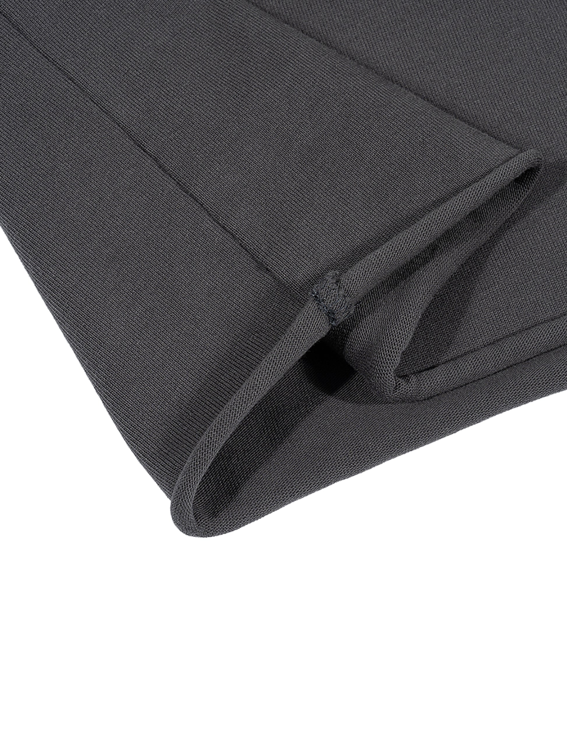 Dark gray t-shirt cut off hem on a white background