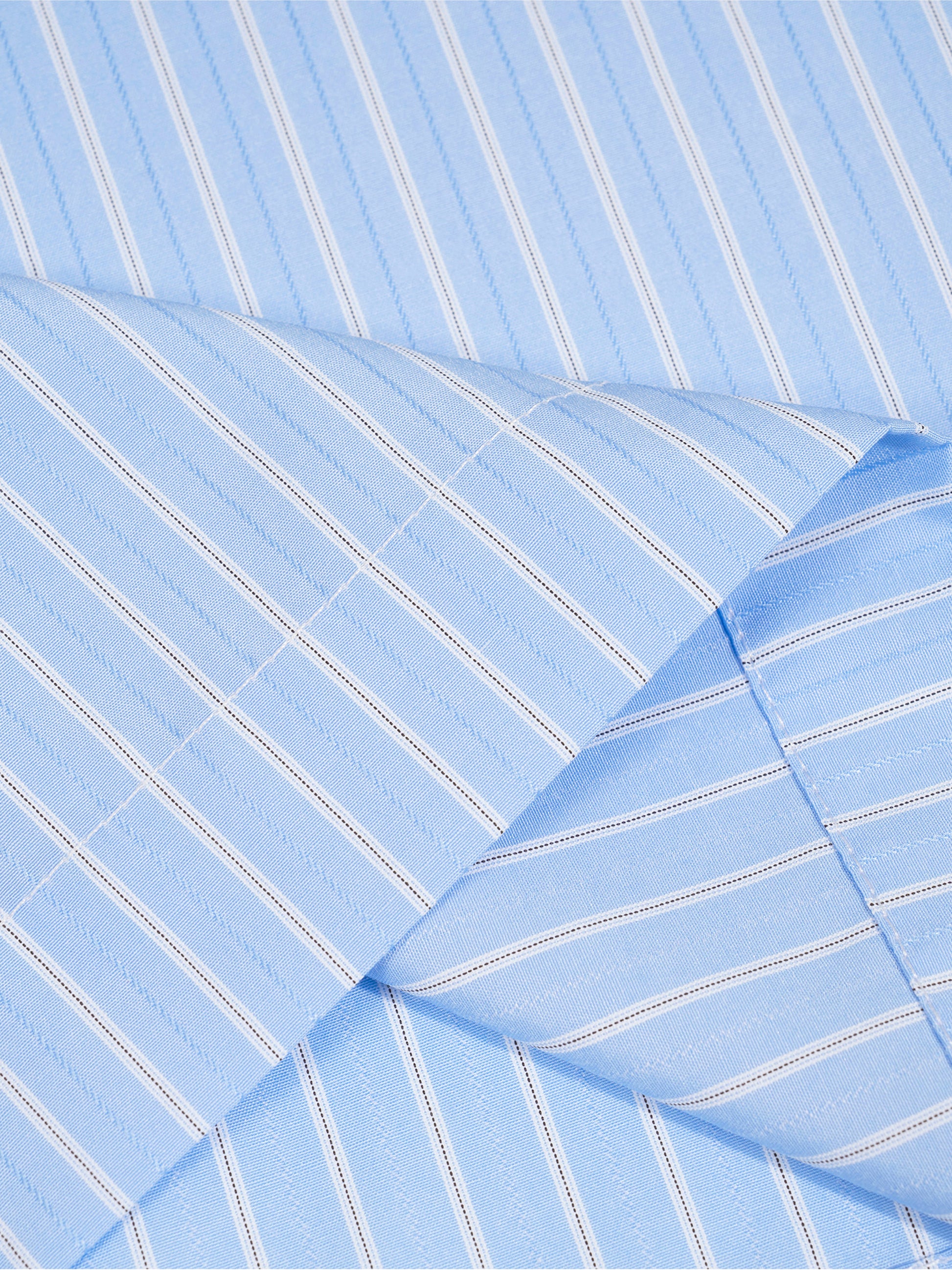 Close-up of blue striped fabric with a diagonal pattern