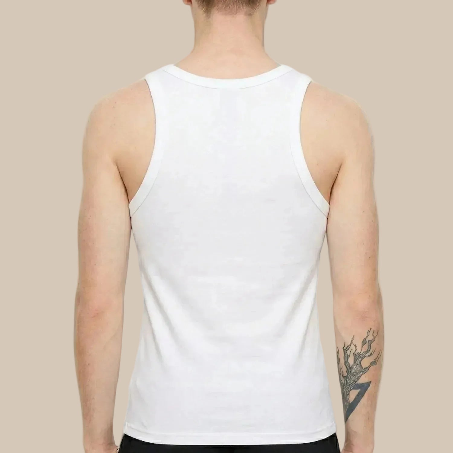 Person wearing a white tank top on a plain background