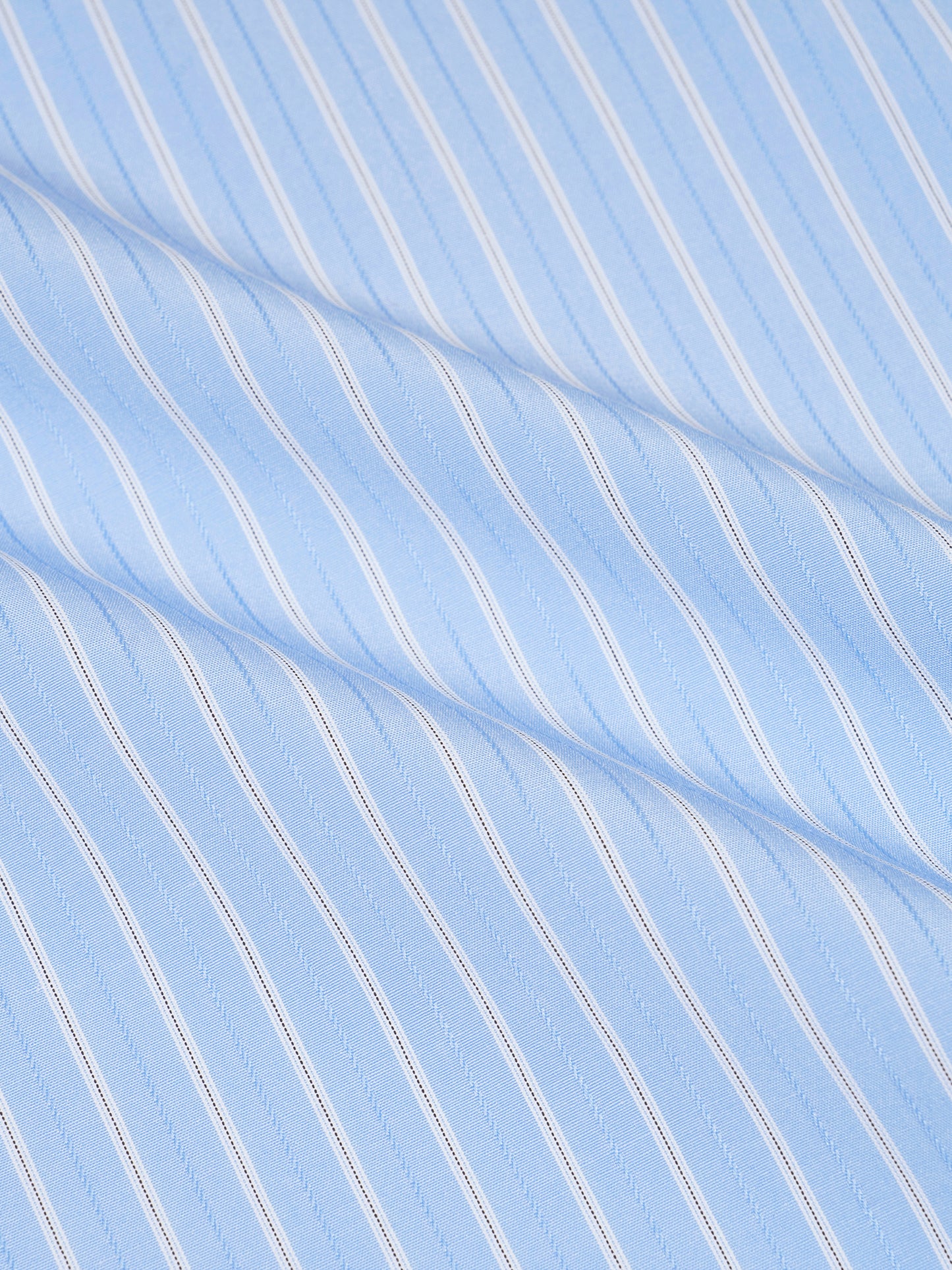 Close-up of light blue fabric with white stripes