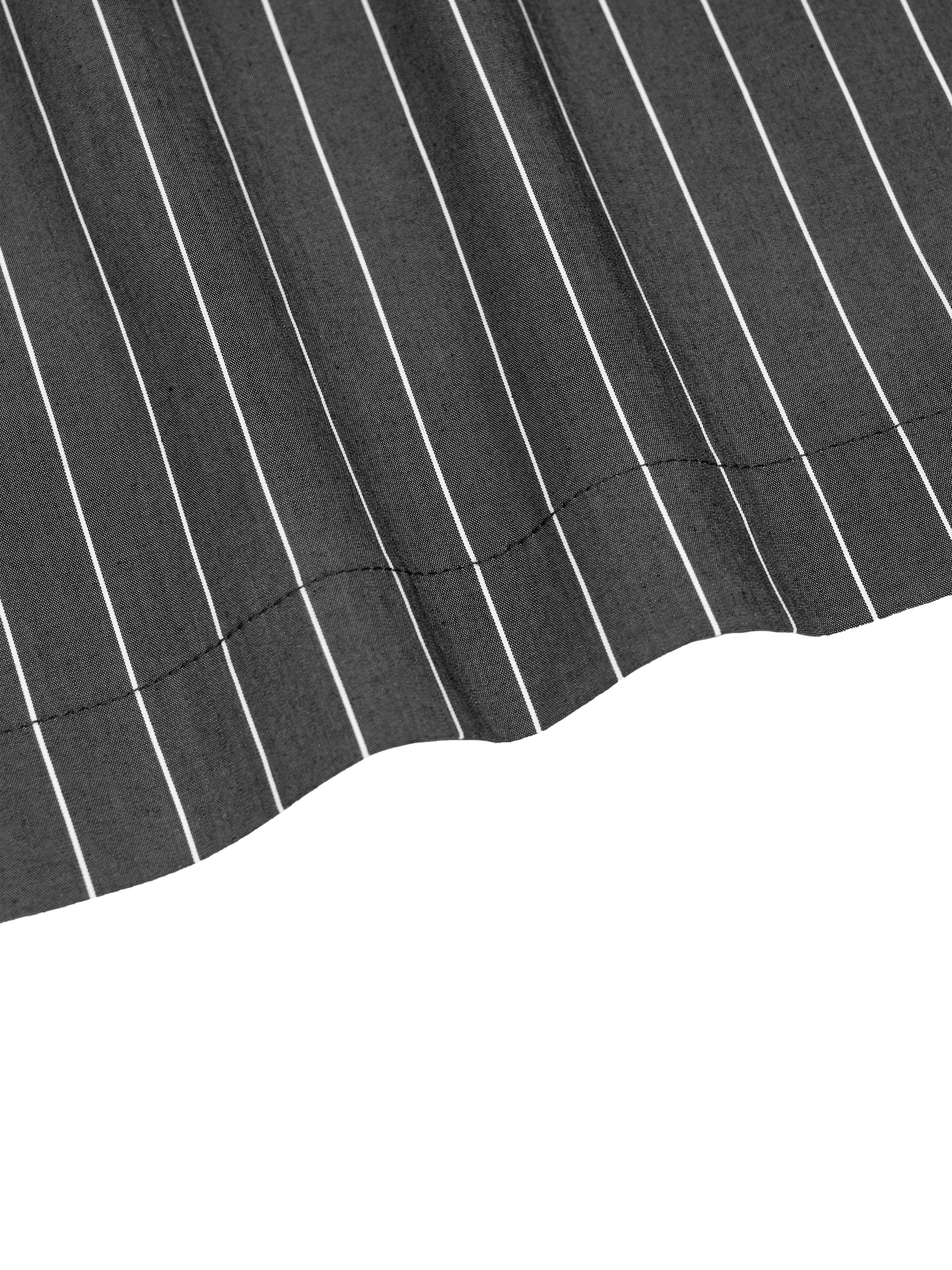 Close-up of a black fabric with white pinstripes on a white background