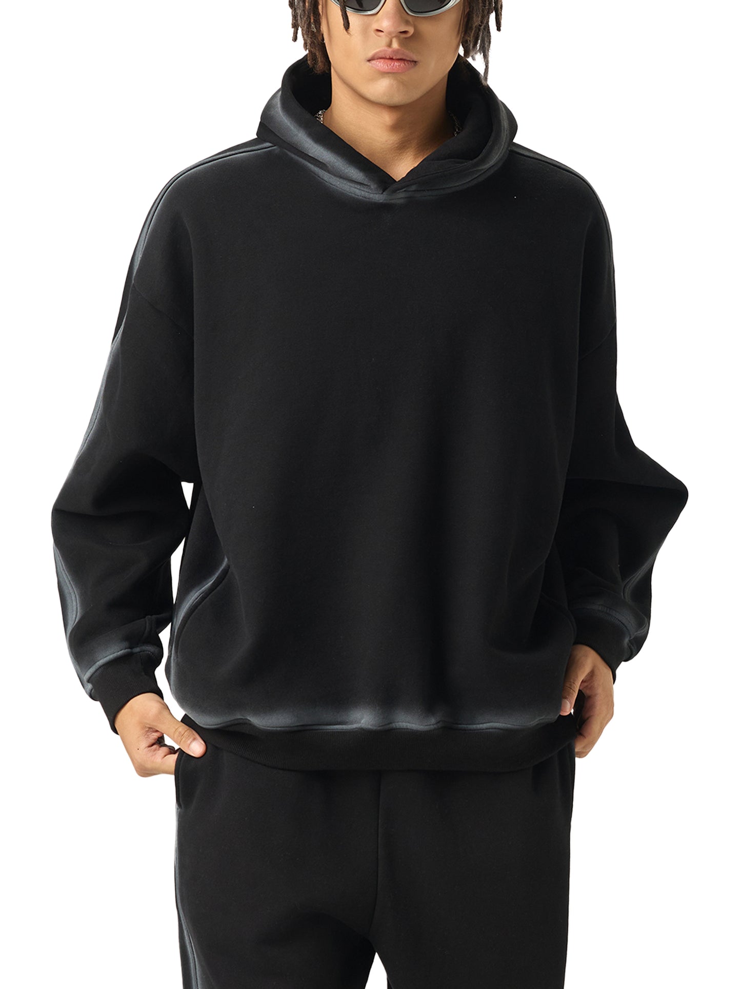 Model wearing the Future-Homme Fleece Please Hoodie in black with white chalk trim front side on a white background 