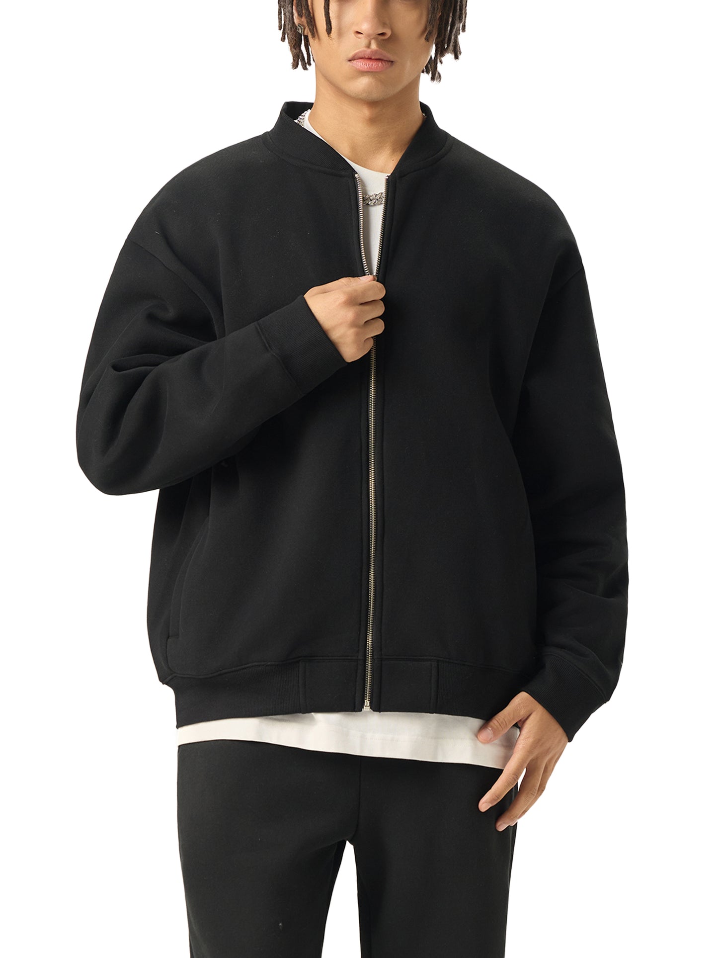 A Future-Homme model wearing the Fleece Please Varsity Jacket front side in black on a white background. 