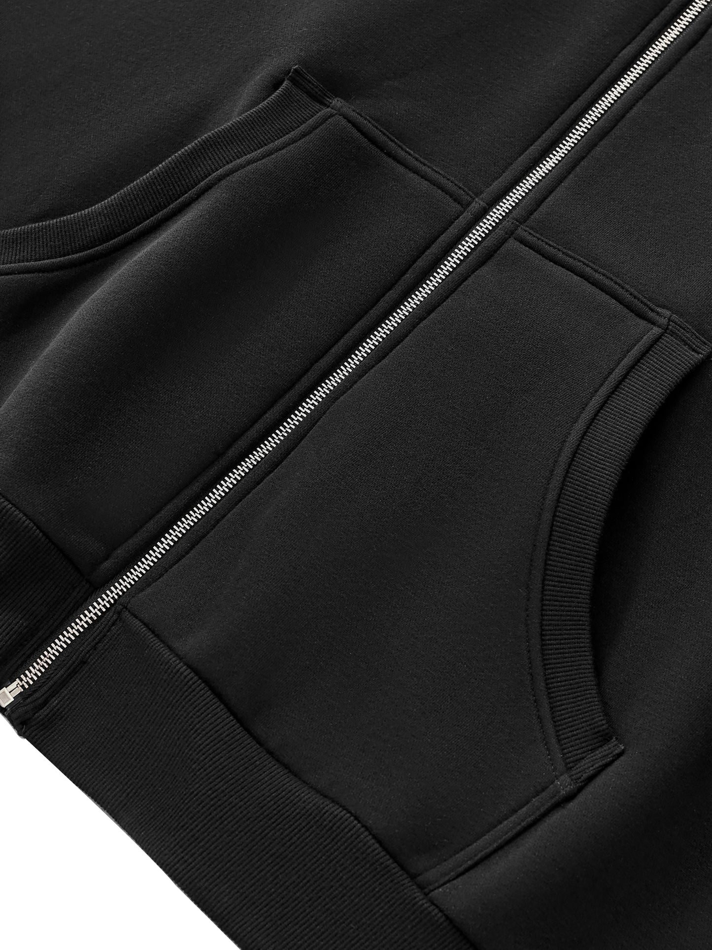 A Future-Homme Fleece Please Close-up of a black jacket with a zipper and pockets on a white background.