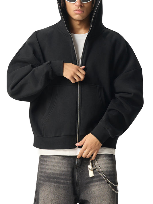 A Future-Homme male model wearing the Fleece Please full zip hoodie with gray jeans on a white background. 