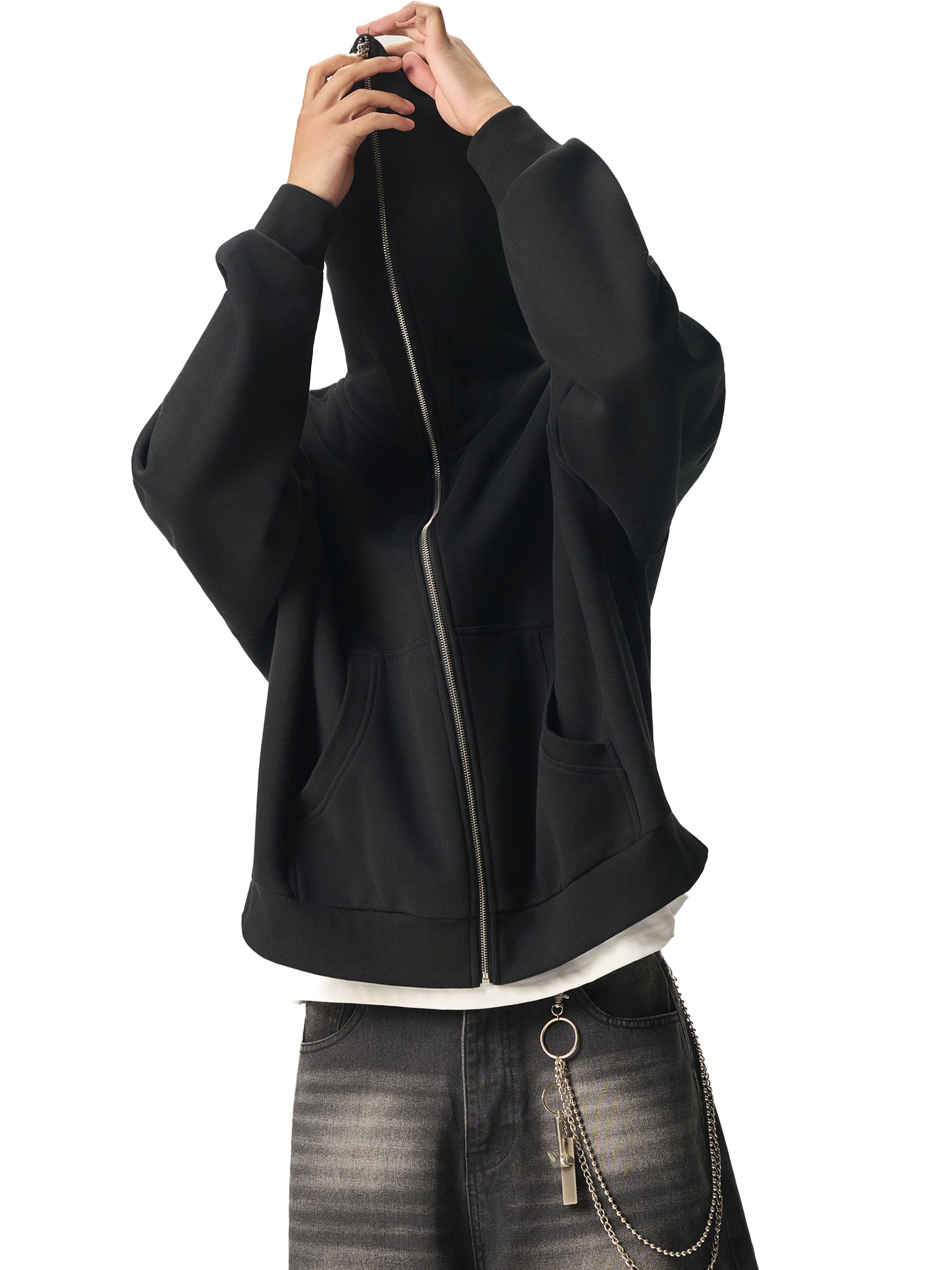 A Future-Home male mode wearing the Fleece Please Full zip hoodie zipped all the way to the top with gray jeans on a white background. 