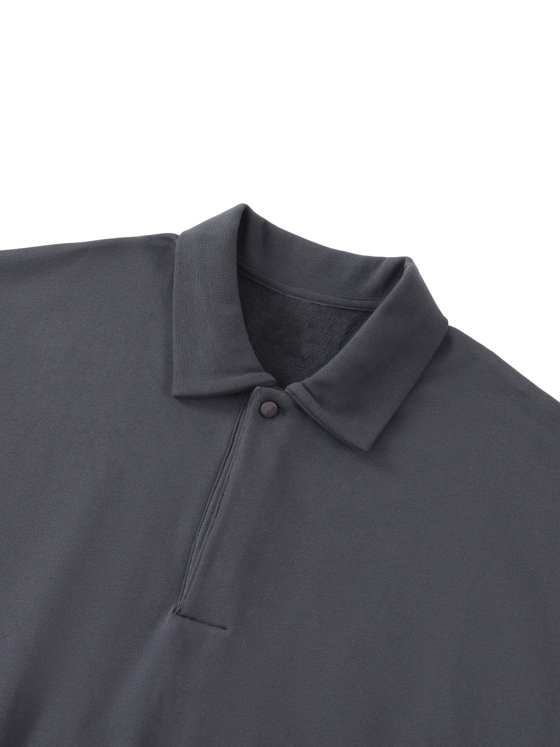 Future-Homme Fleece Please Heavyweight Polo Sweatshirt in black close up shot of collar, placket and covered button on a white background. 