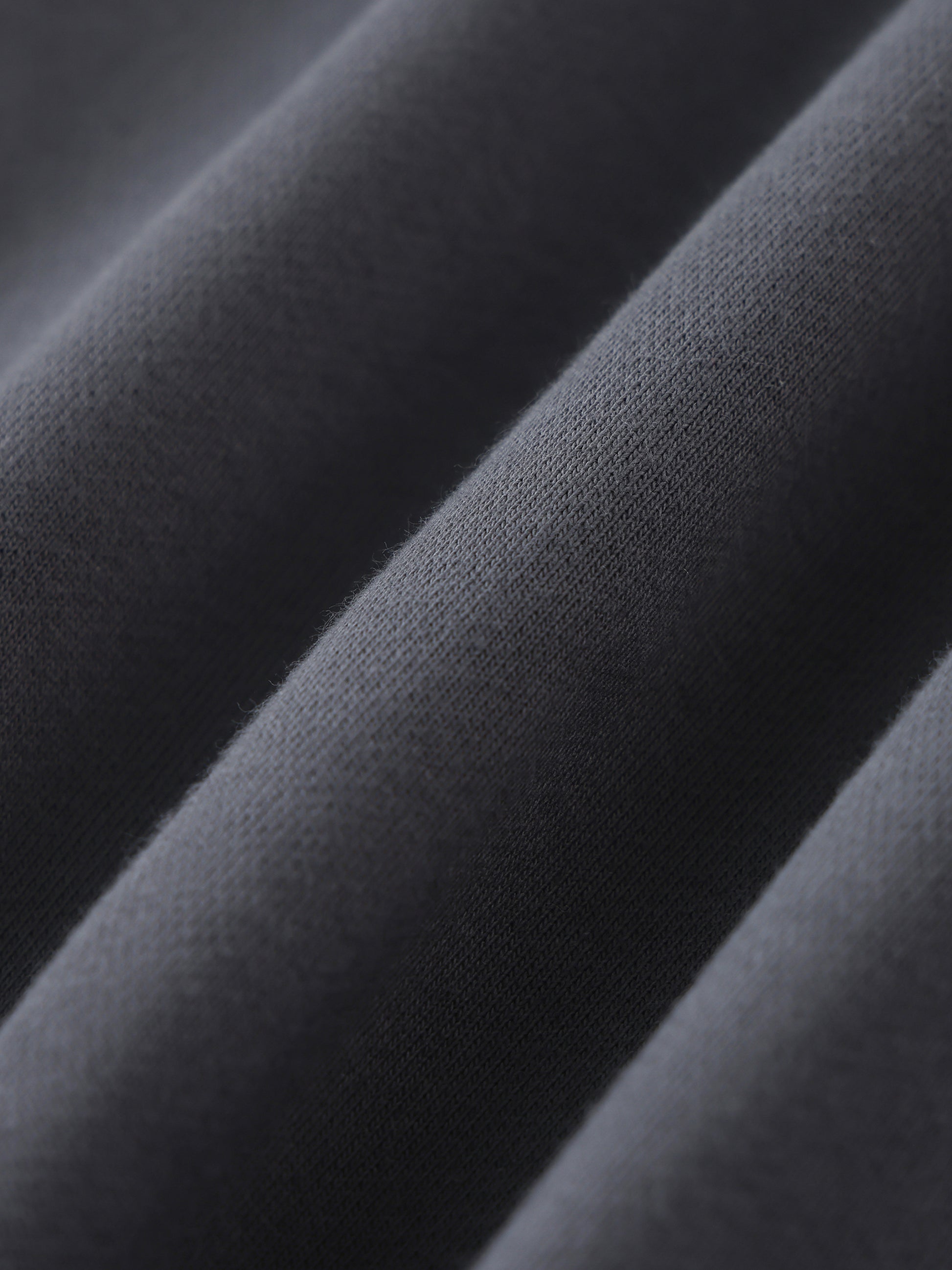Future-Homme fabric swatch of Close-up of dark gray fabric with a textured surface