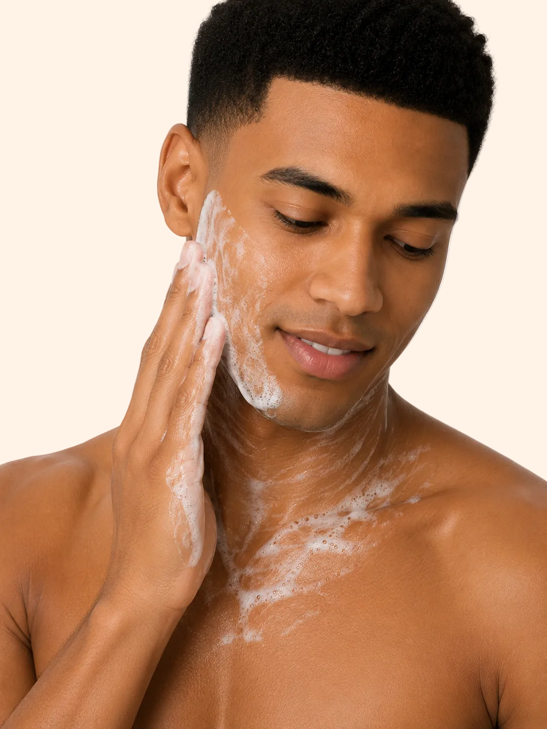 Man applying soap to his face against a white background