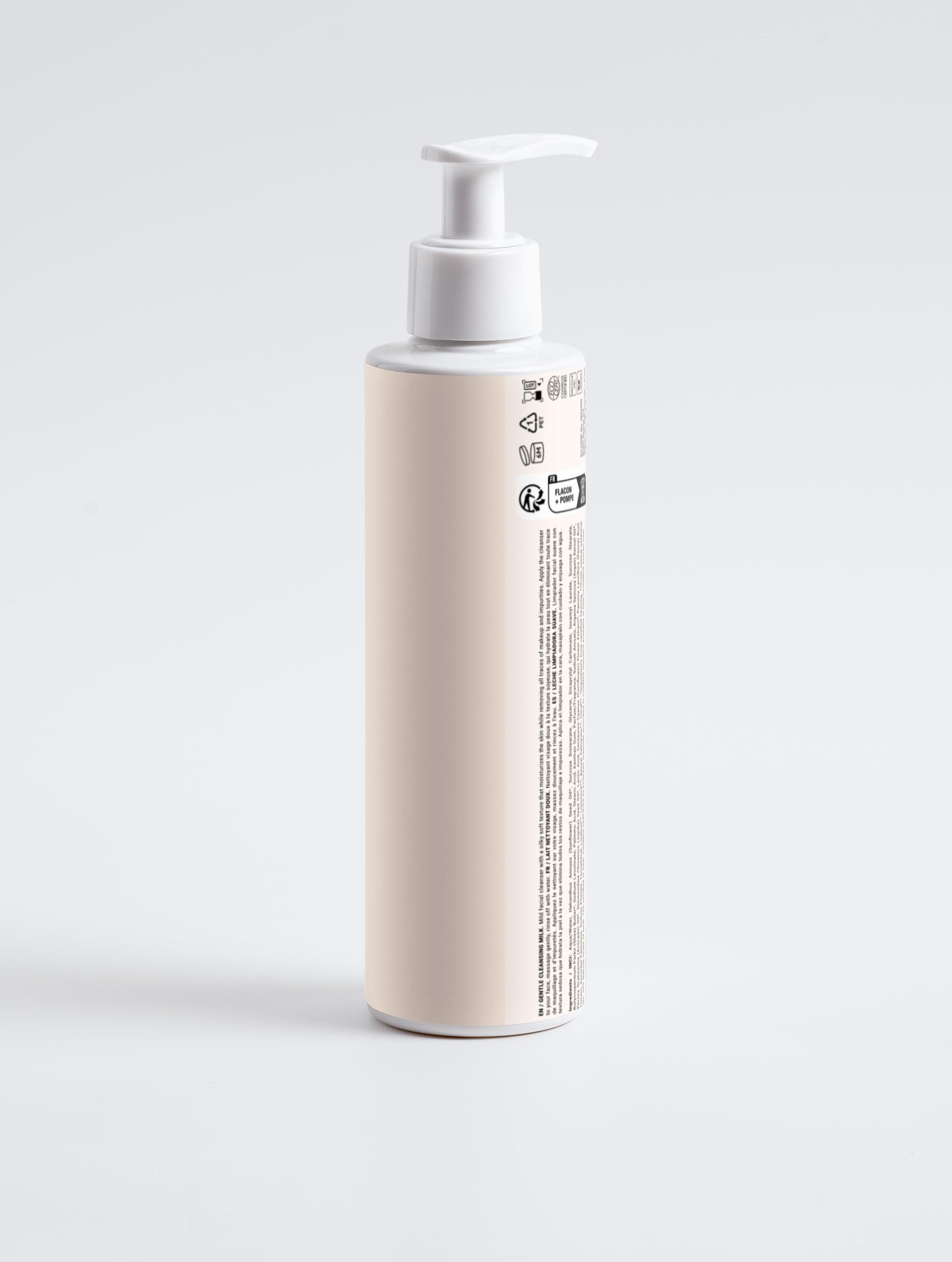 Beige bottle with pump on a light gray background