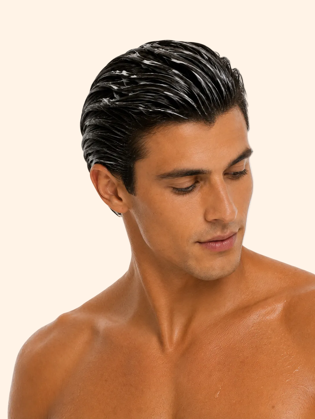 Man with styled black hair on a gray background