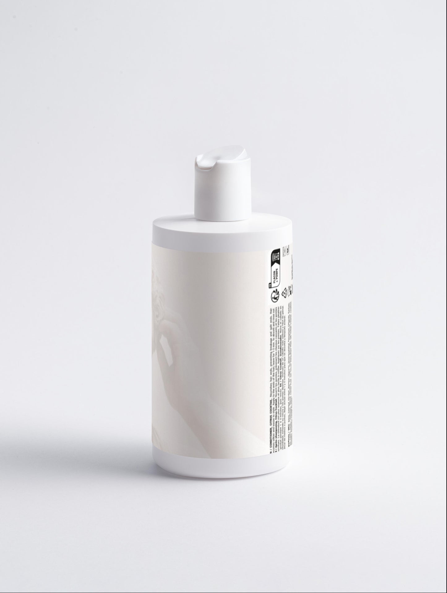 White bottle with a pump on a light gray background
