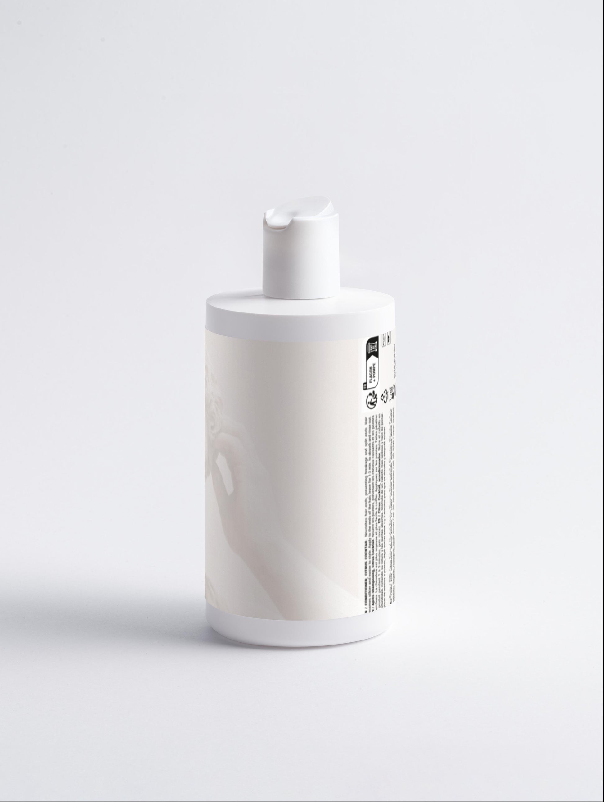 White bottle with a pump on a light gray background