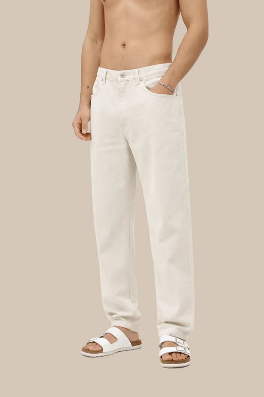 Person wearing white pants on a white background