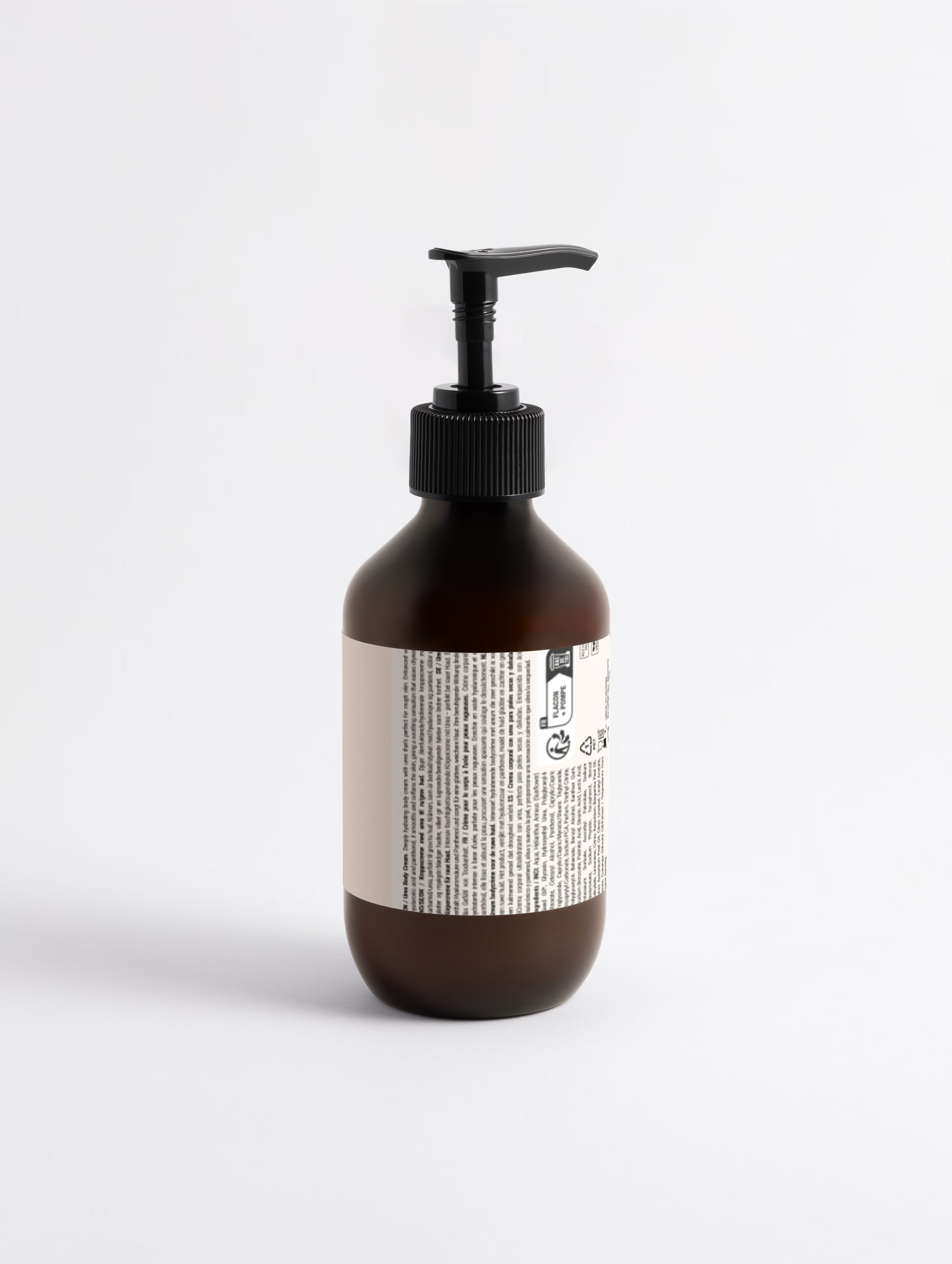 Brown bottle with pump and label on a white background
