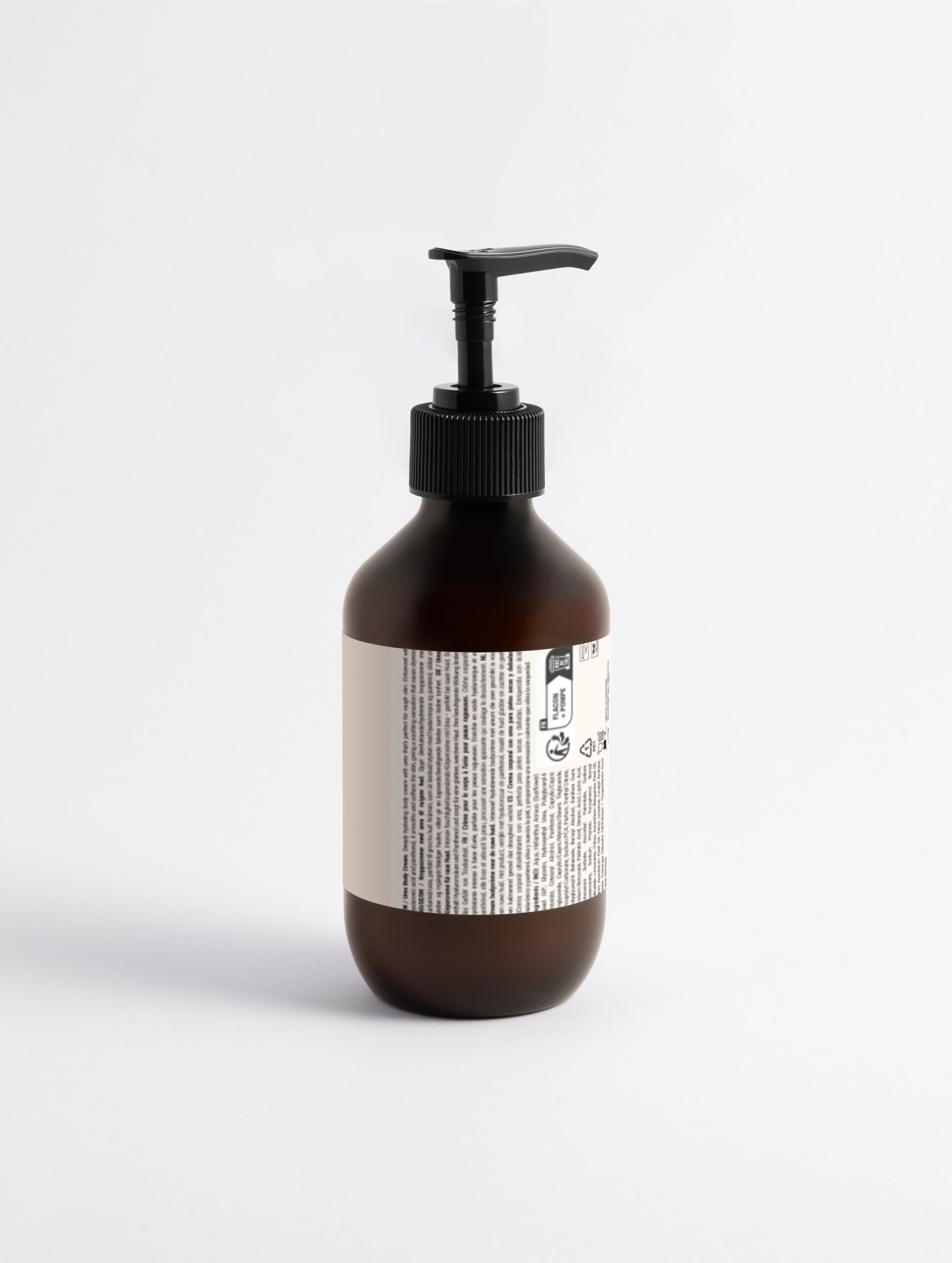 Brown bottle with pump and label on a white background