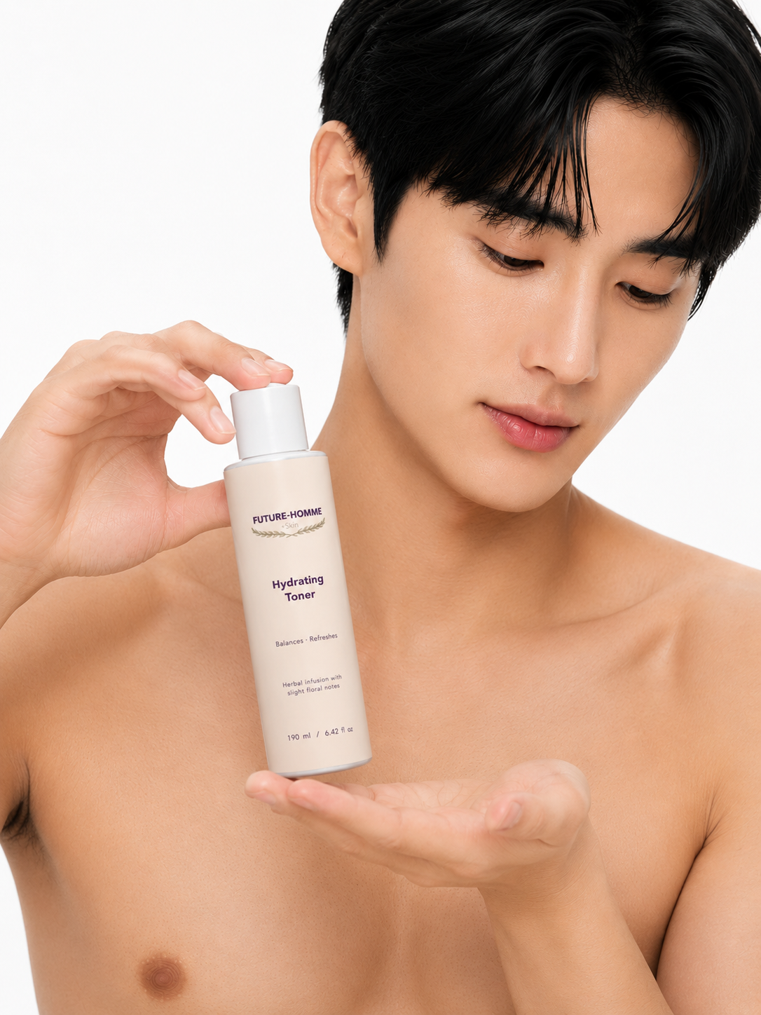 Man holding a bottle of 'Future-Homme' hydrating toner against a white background