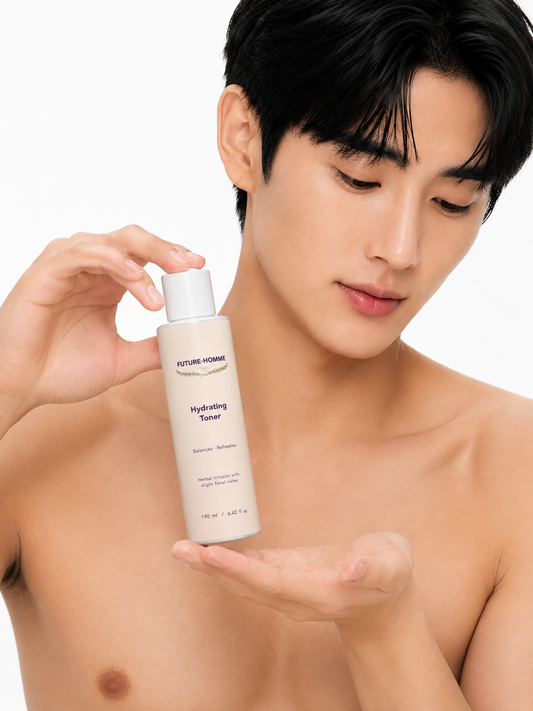 Man holding a bottle of 'Future-Homme' hydrating toner against a white background