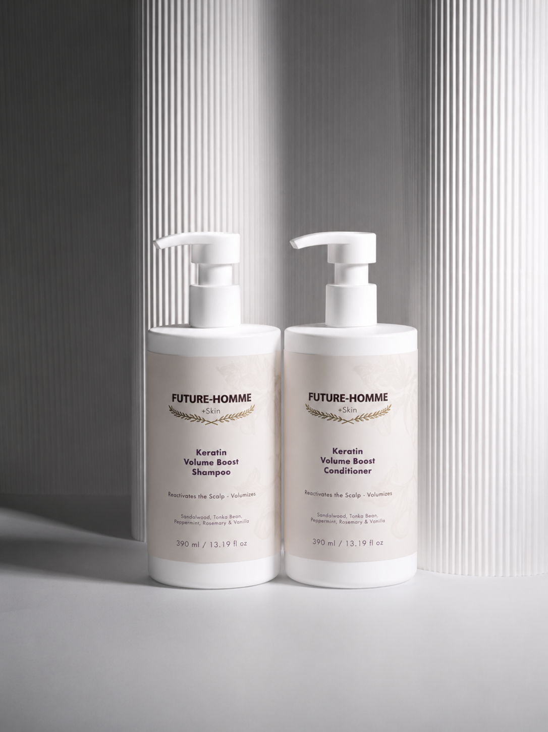 Two bottles of Future-Homme shampoo and conditioner on a light gray background