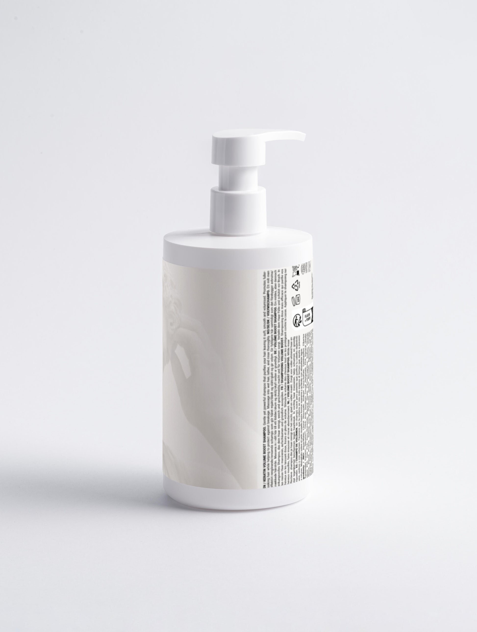 White bottle with a pump on a light gray background
