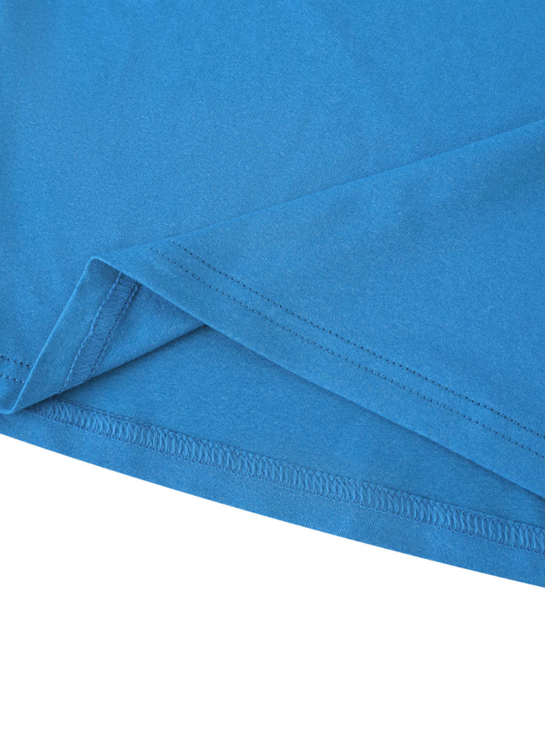 Close-up of a blue hem with a visible seam on a white background