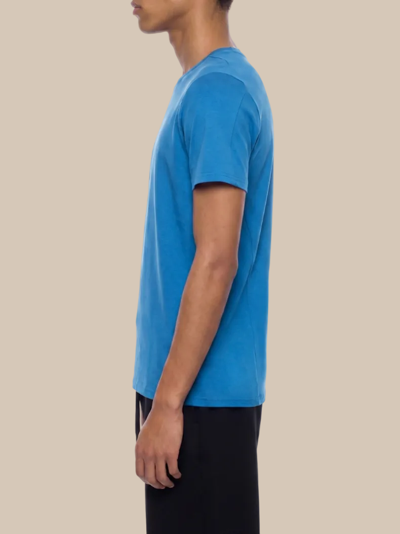 Person wearing a blue t-shirt on a white background
