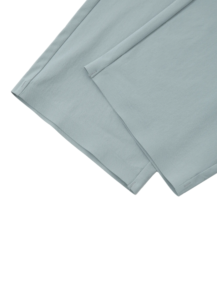 Close-up shots of the leg openings of the track pant on a white background