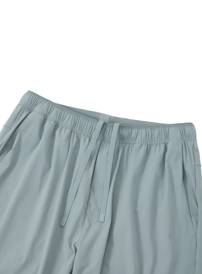 Light gray pants with an elastic waistband on a white background