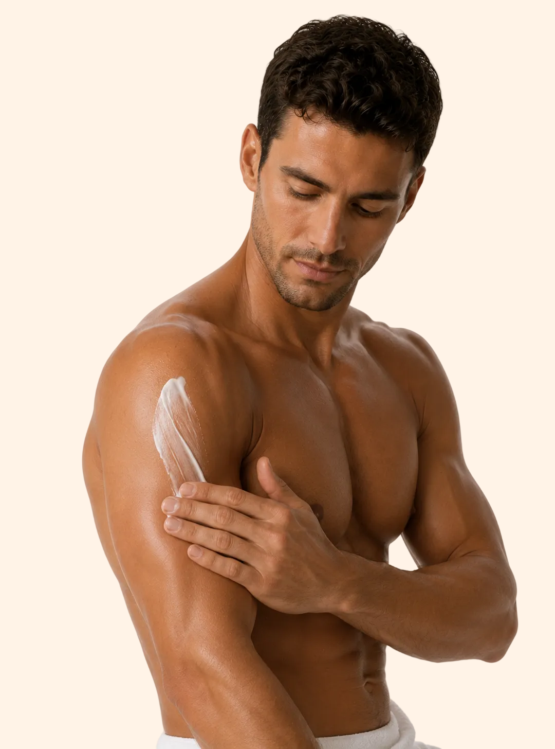 Man applying a white cream or lotion to his arm on a plain background