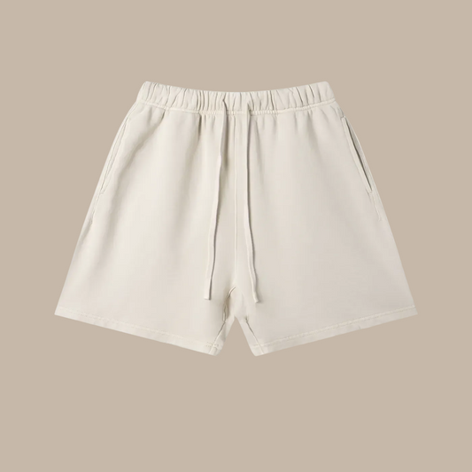 Beige shorts with a brand logo on a beige background