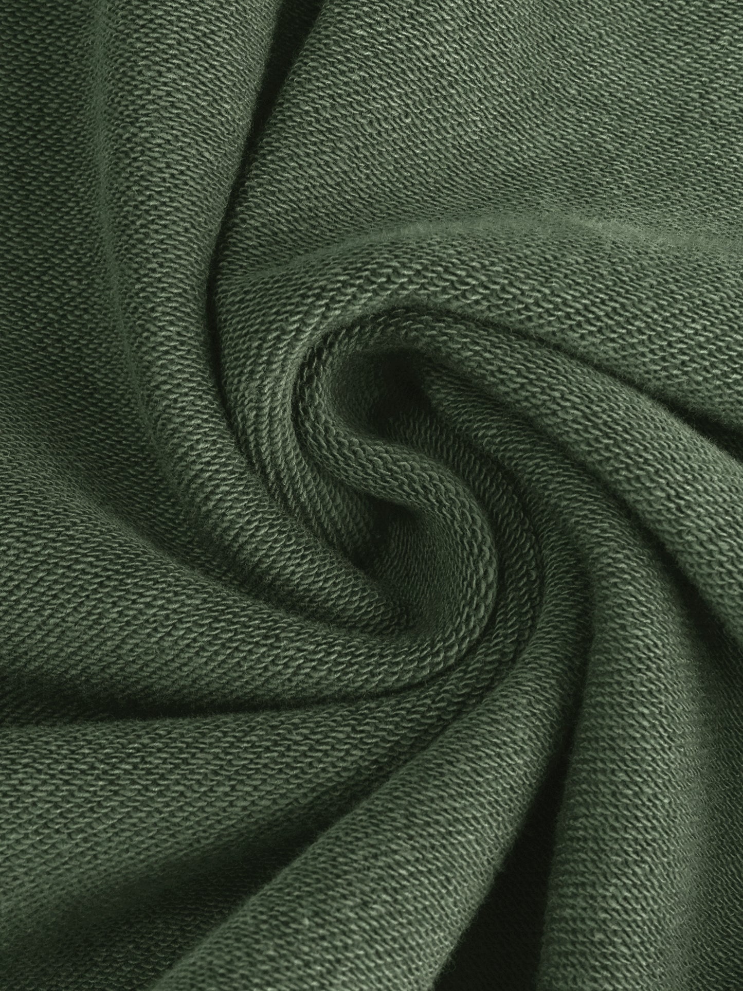 Close-up of dark green fabric with visible texture