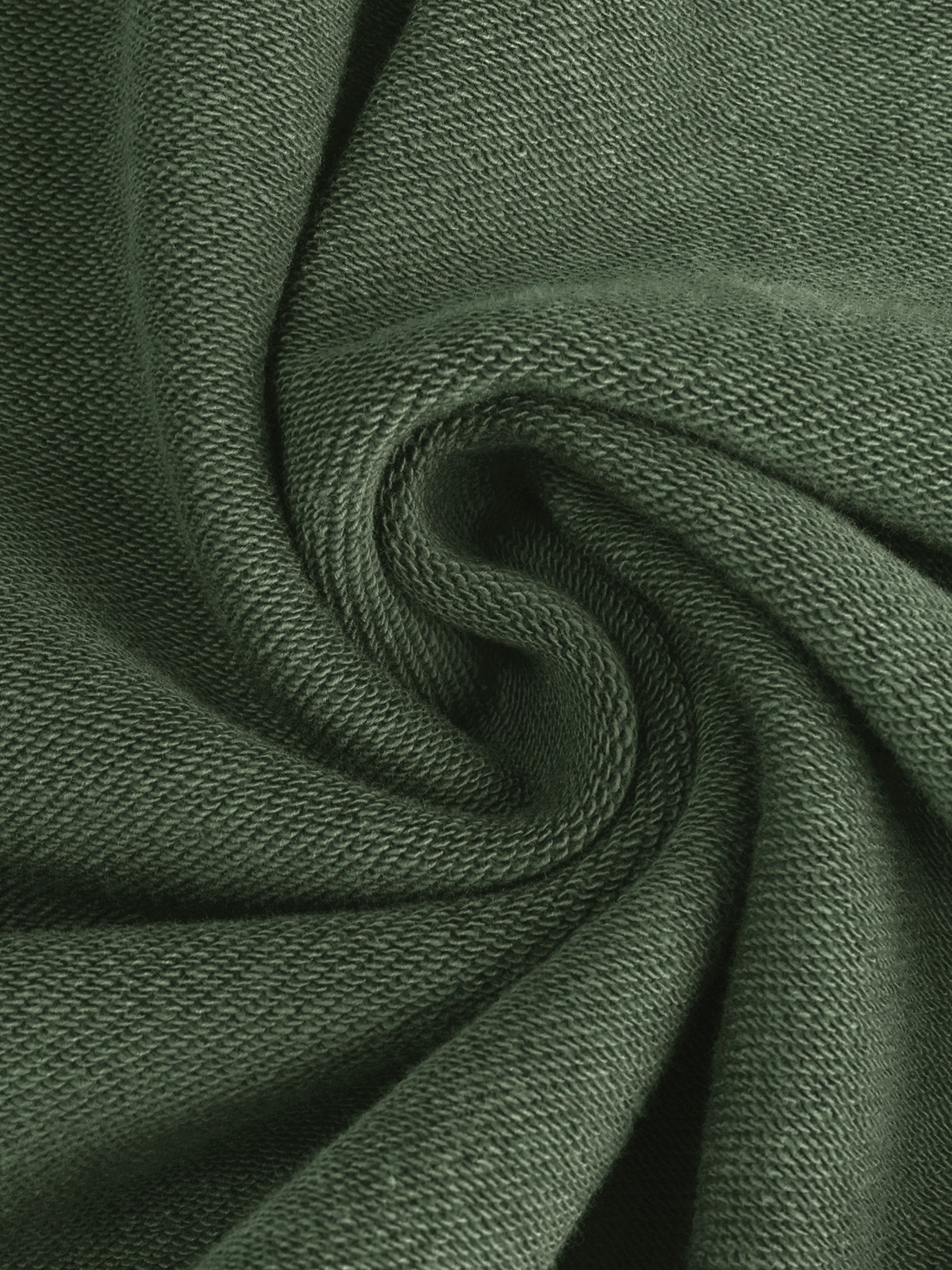Close-up of dark green fabric with visible texture