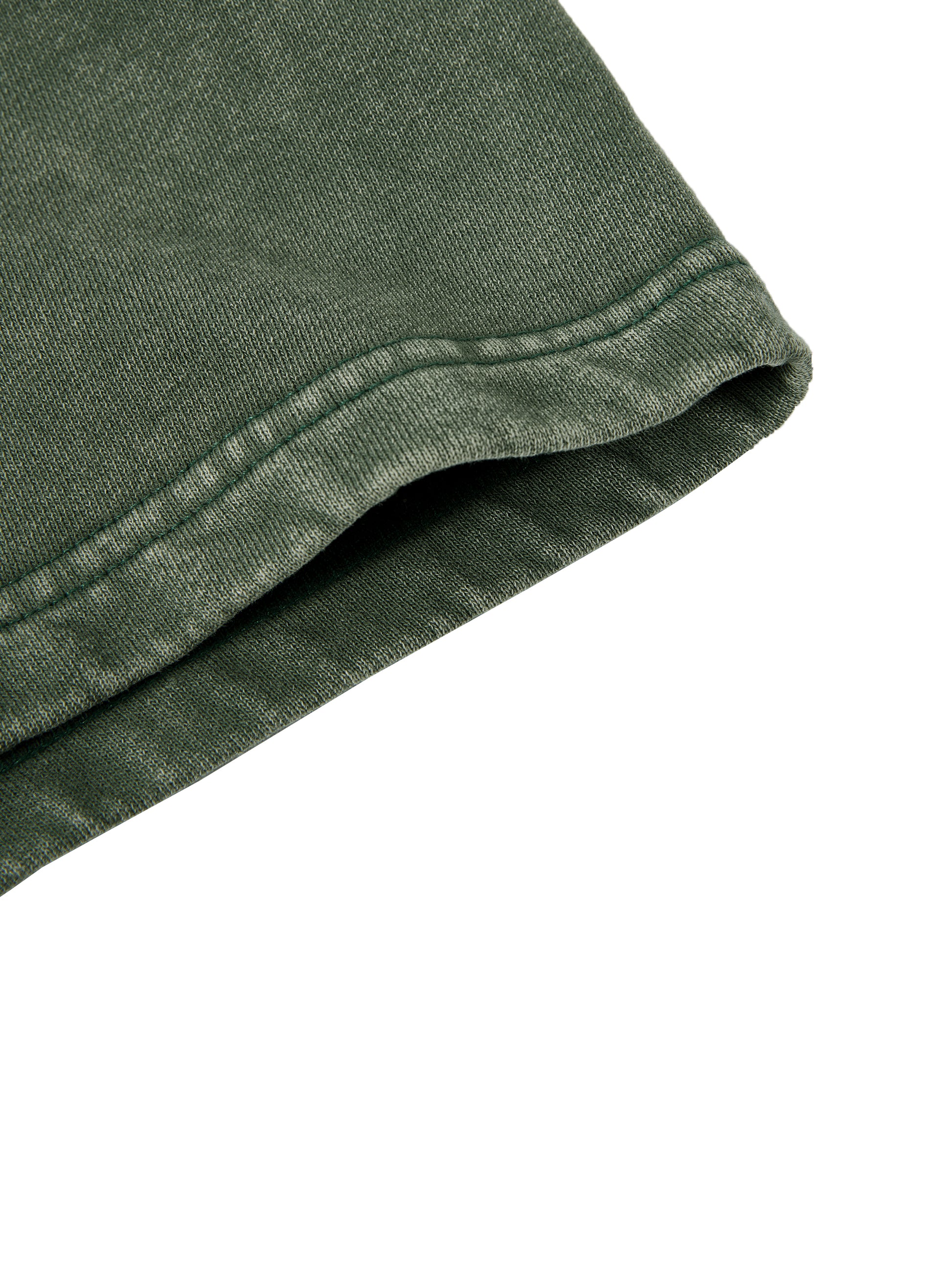 Close-up of a green fabric texture on a white background