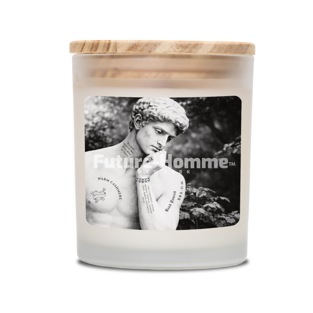 Candle with a wooden lid featuring a black and white photo of a person on the label, with 'Future Homme' branding.
