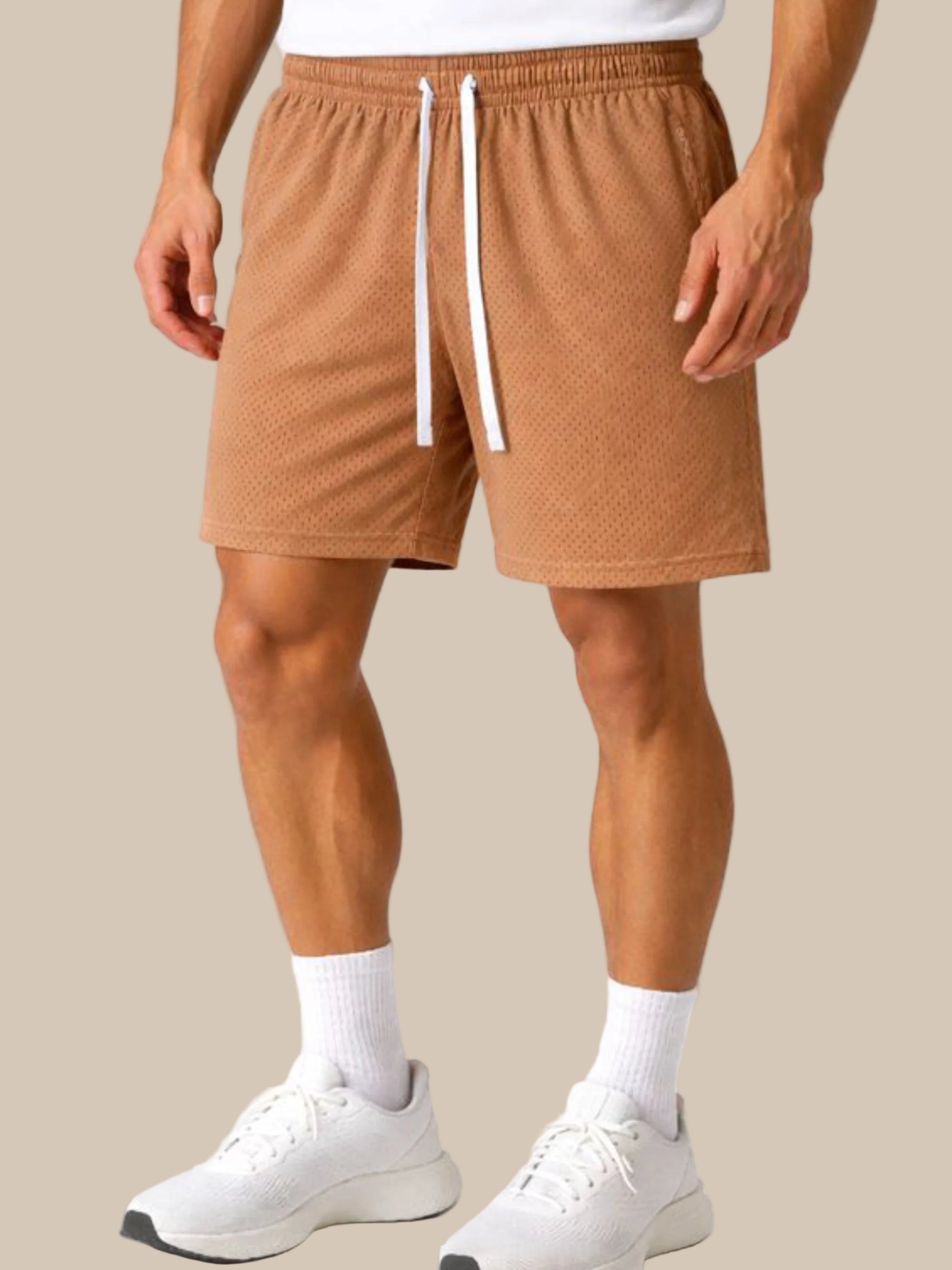 Person wearing brown shorts with a white drawstring on a white background