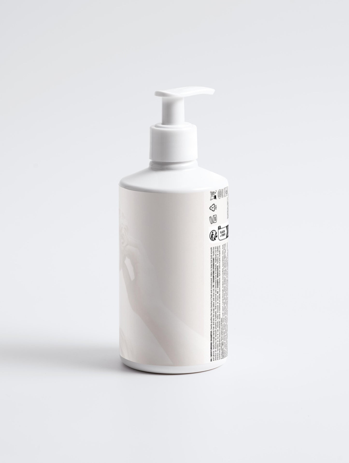 White bottle with pump dispenser on a light gray background