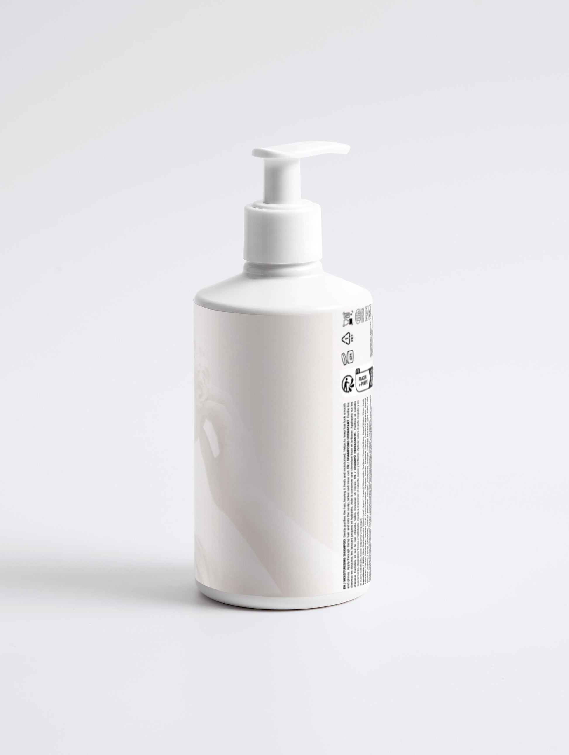 White bottle with pump dispenser on a light gray background