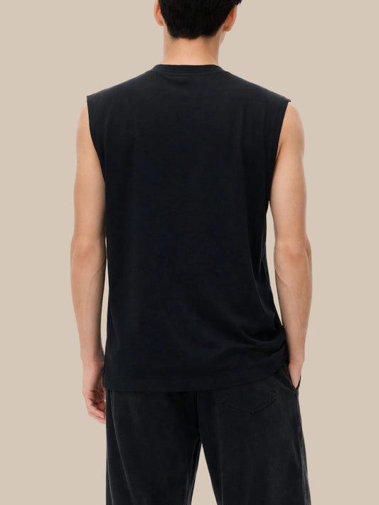 Person wearing a black sleeveless shirt and pants on a white background