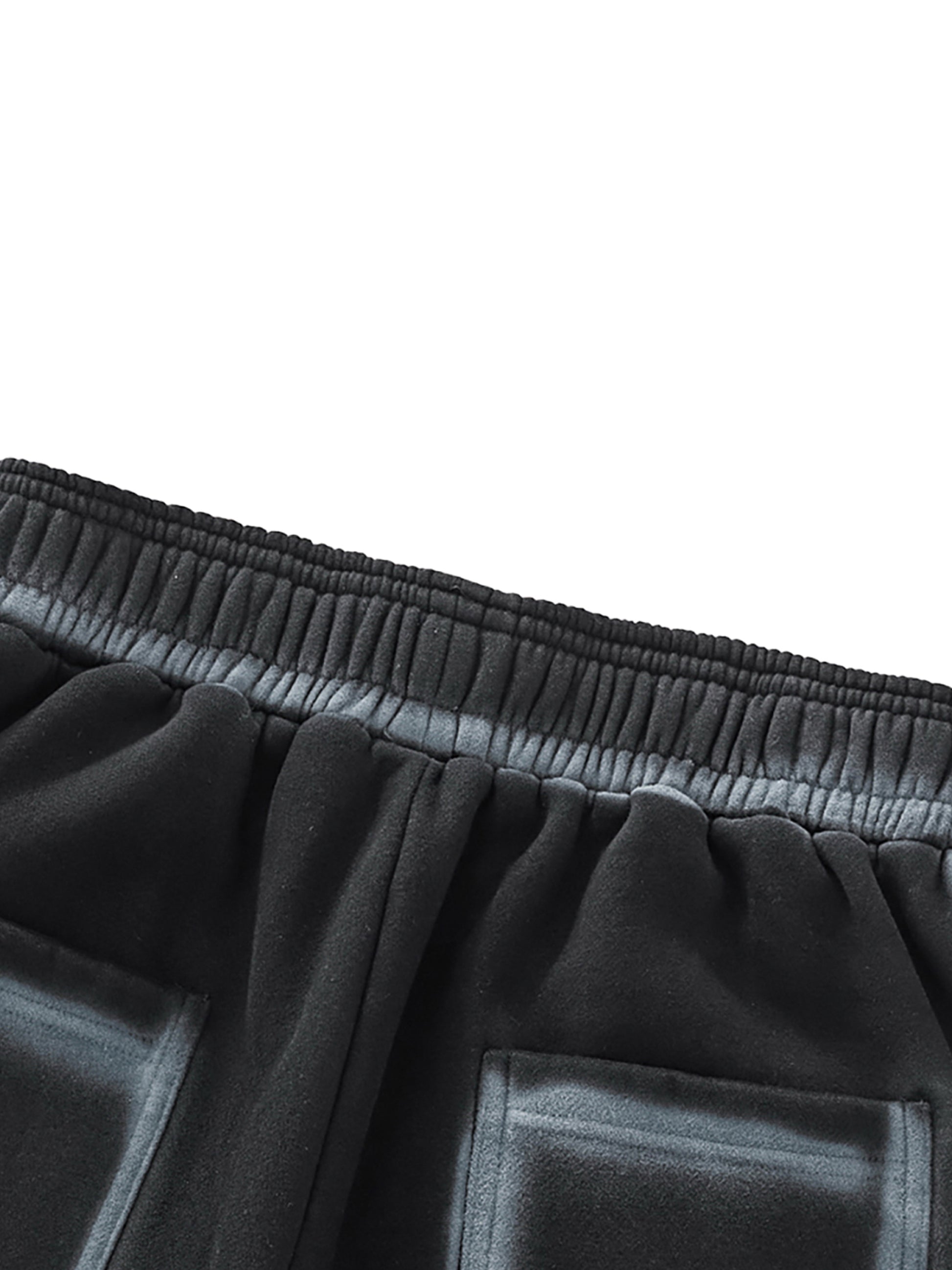 A flat lay of the Future-Homme Ombre Effect Fleece Sweatpants in black back side pocket up close view on a white background.