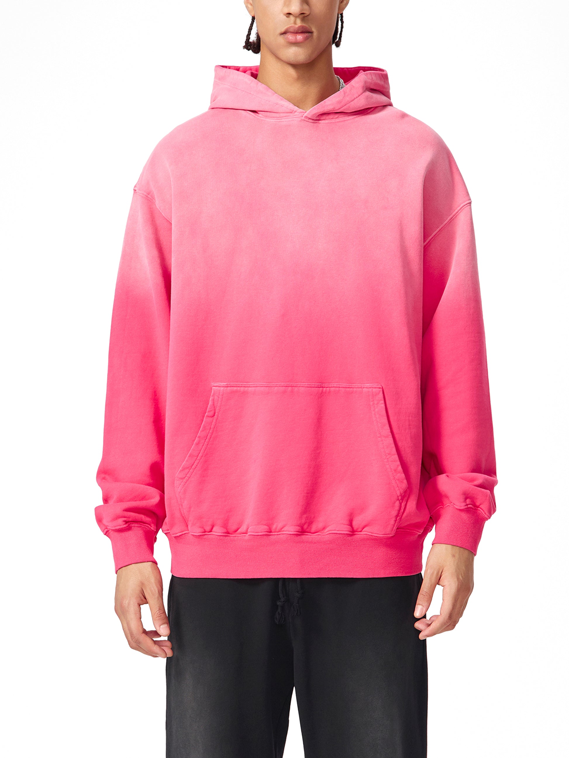 Model wearing a sustainable Future-Homme Ombre Hoodie with kangaroo pockets in pink frontside on a white background. 