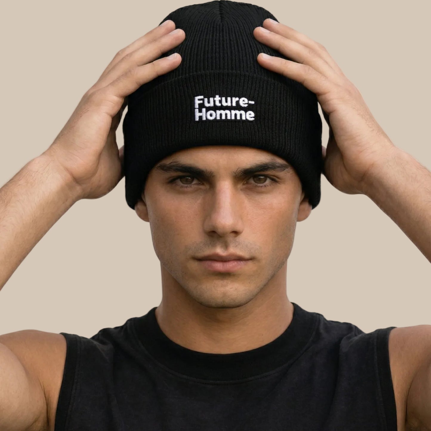Man wearing a black beanie with 'Future Homme' text against a white background