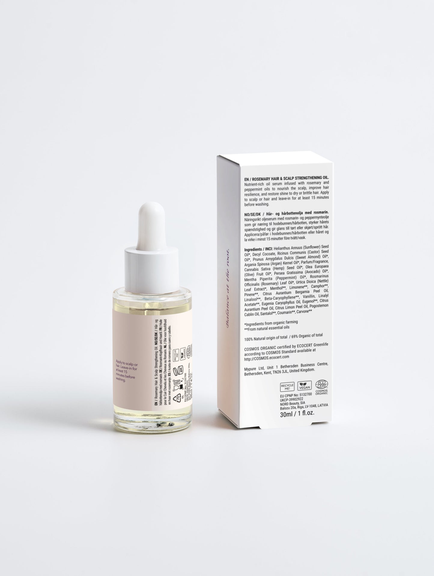 Skincare serum bottle with dropper and its packaging on a white background