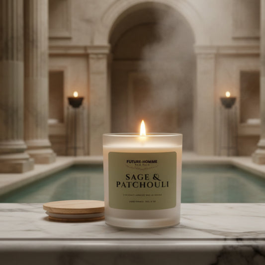 Sage & Patchouli candle on a marble surface with a blurred architectural background