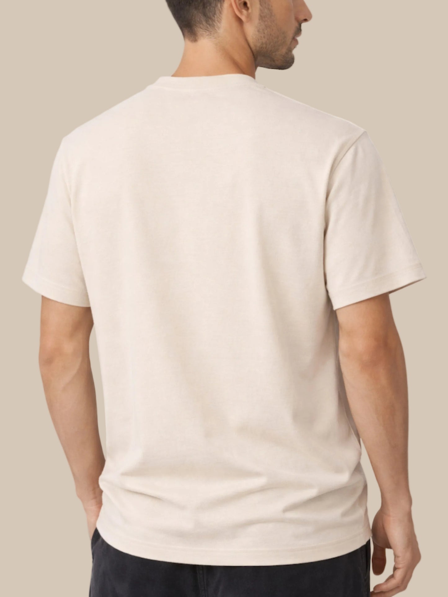 Man wearing a beige t-shirt on a white background