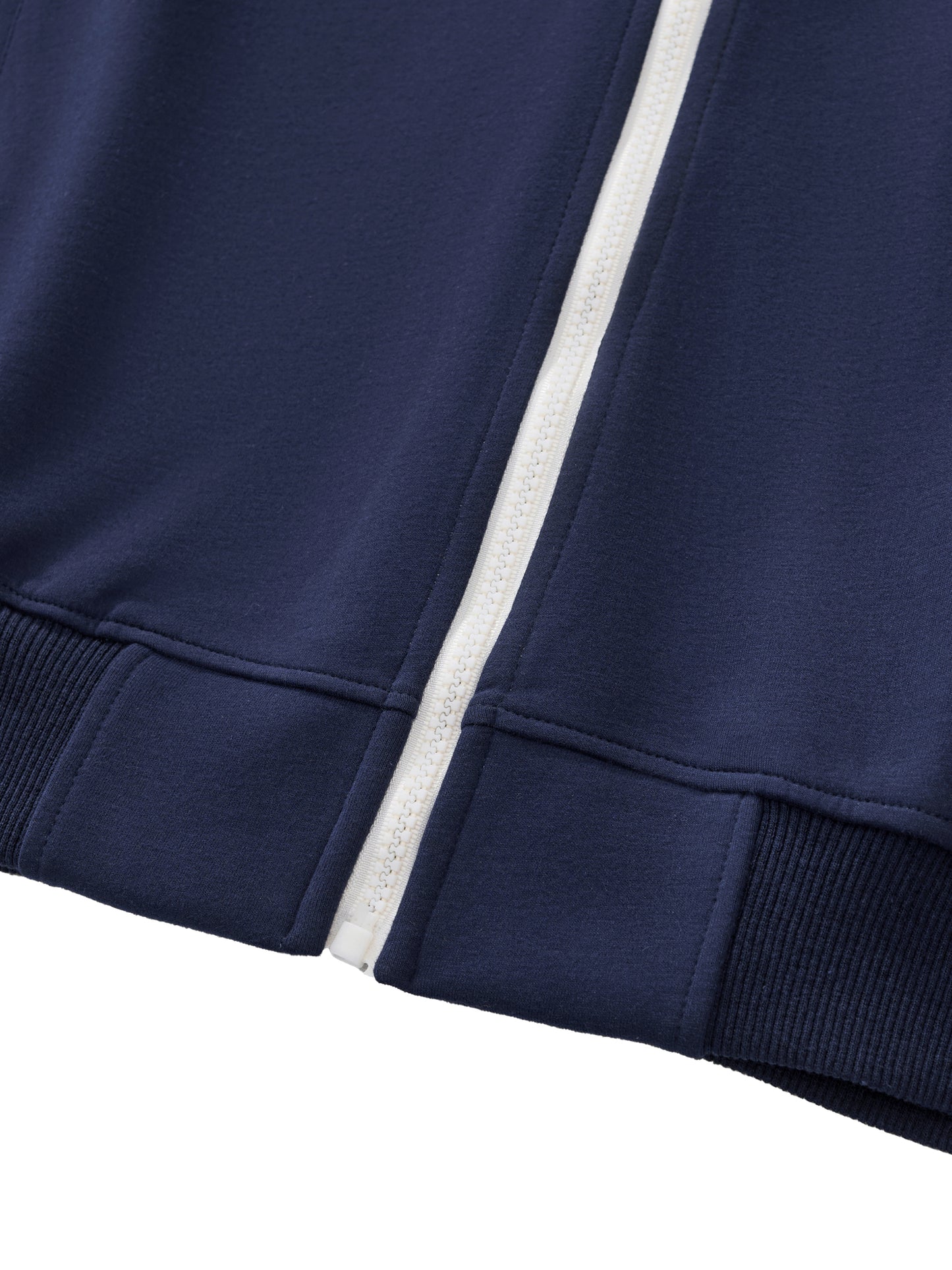 A flat lay of a Future-Homme blue Track Zip up Jacket 340 GSM sustainably made-to-order up close waistband on a white background